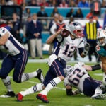 New England Patriots quarterback Tom Brady (12) runs the ball, during the second half of an NFL football game against the Miami Dolphins, Monday, Dec. 11, 2017, in Miami Gardens, Fla. (AP Photo/Wilfredo Lee)