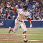 Mookie Betts celebrates his home run against the Blue Jays to complete the cycle.