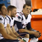 Tom Brady, Julian Edelman and Chris Hogan on the sidelines during a preseason loss to the Panthers.