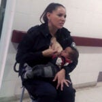 cop breastfeeds baby
