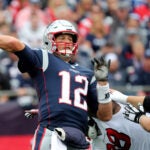 Tom Brady throwing a pass in Week 1 against the Texans.