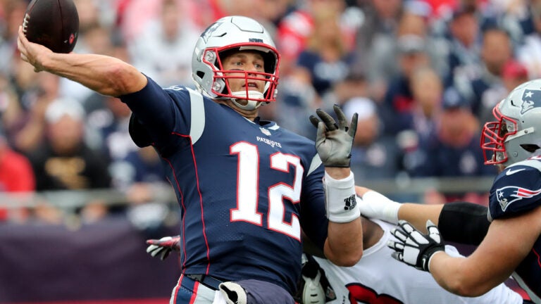 Tom Brady throwing a pass in Week 1 against the Texans.