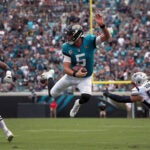 Blake Bortles jumps over Patriots defender.