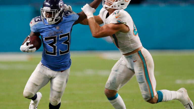 Dion Lewis of the Titans against Kiko Alonso of the Dolphins.