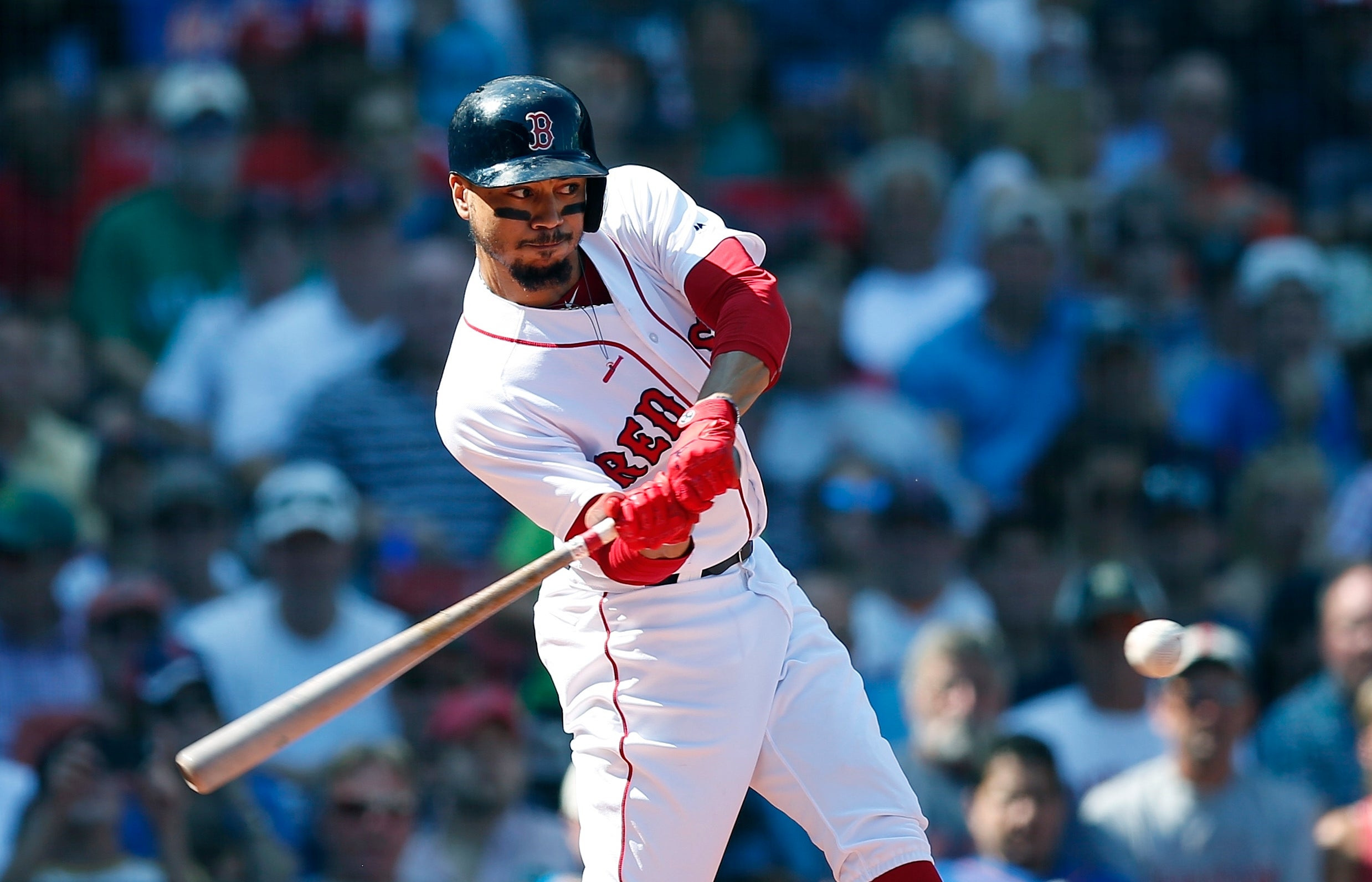 Mookie Betts accidentally hit a NESN reporter with his champagne cork  during the Red Sox clubhouse celebration