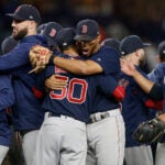 Xander and Mookie celebrate the 2018 division.