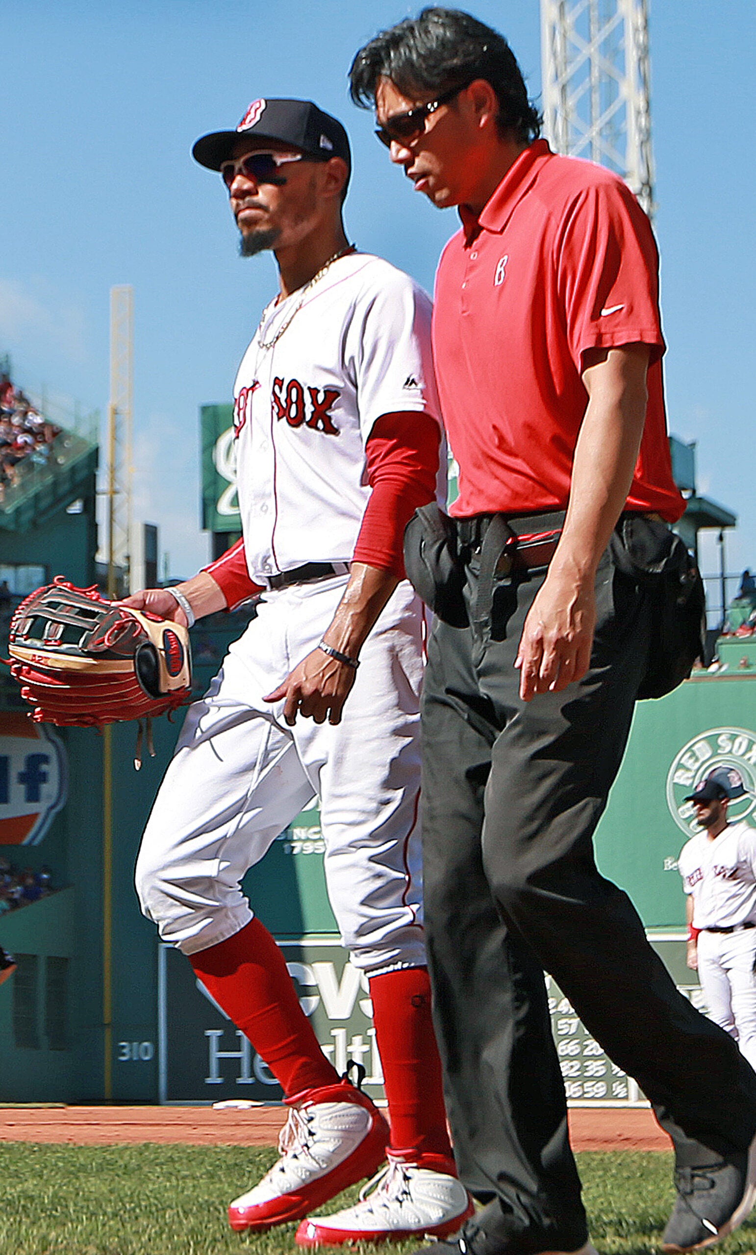 Mookie Betts accidentally hit a NESN reporter with his champagne cork  during the Red Sox clubhouse celebration