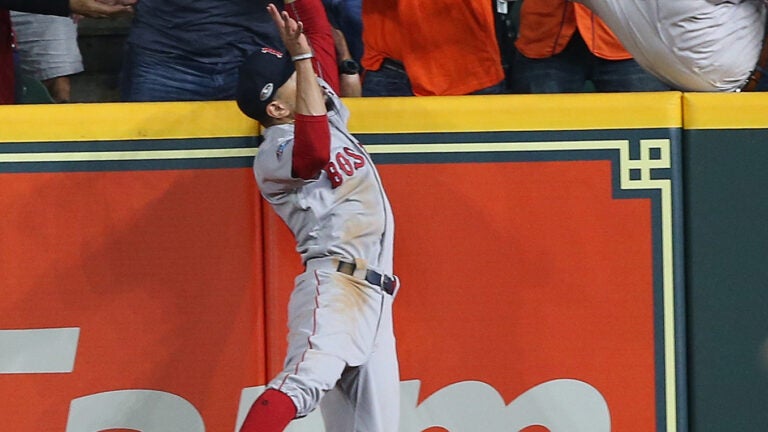 Fan interferes with attempt by Boston Red Sox's Mookie Betts to