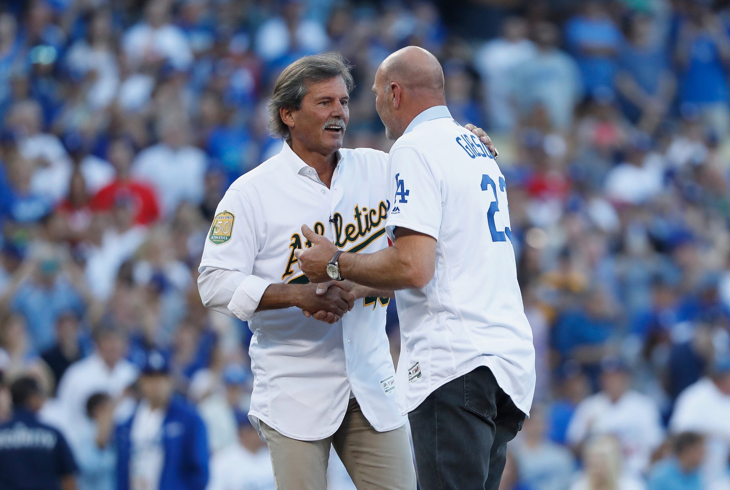 Dennis Eckersley threw out the first pitch to Kirk Gibson before