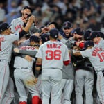 The Red Sox celebrate in Yankee Stadium after advancing to the ALCS.