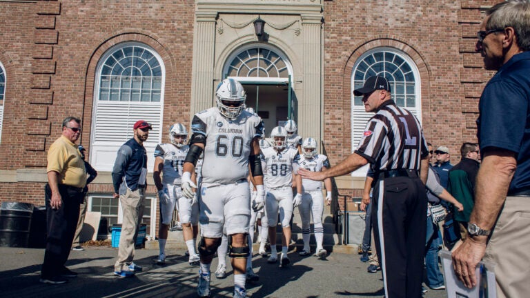 The Columbia University Lions take the field for a game against Dartmouth, in Hanover, N.H.