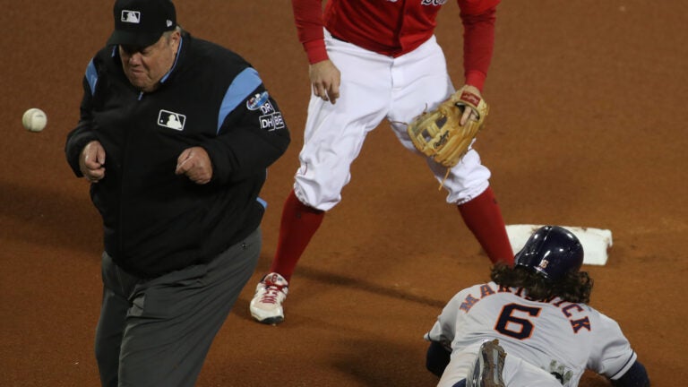 Brock Holt of the Boston Red Sox reacts to advancing to second