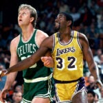 Larry Bird and Magic Johnson position for a rebound