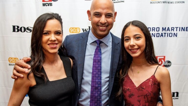 Boston Red Sox manager Alex Cora hugs his daughter Camilla after