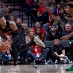 Marcus Smart against Damian Lillard.