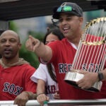 Alex Cora with the World Series trophy