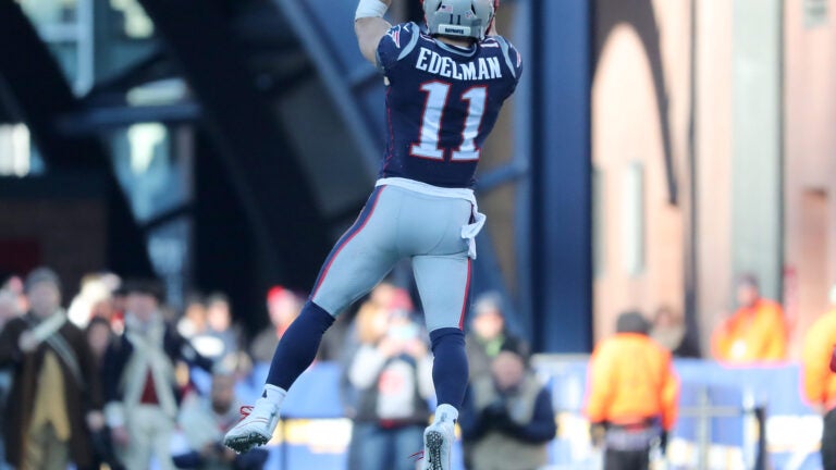 New England Patriots Julian Edelman gets tackled by New York Jets