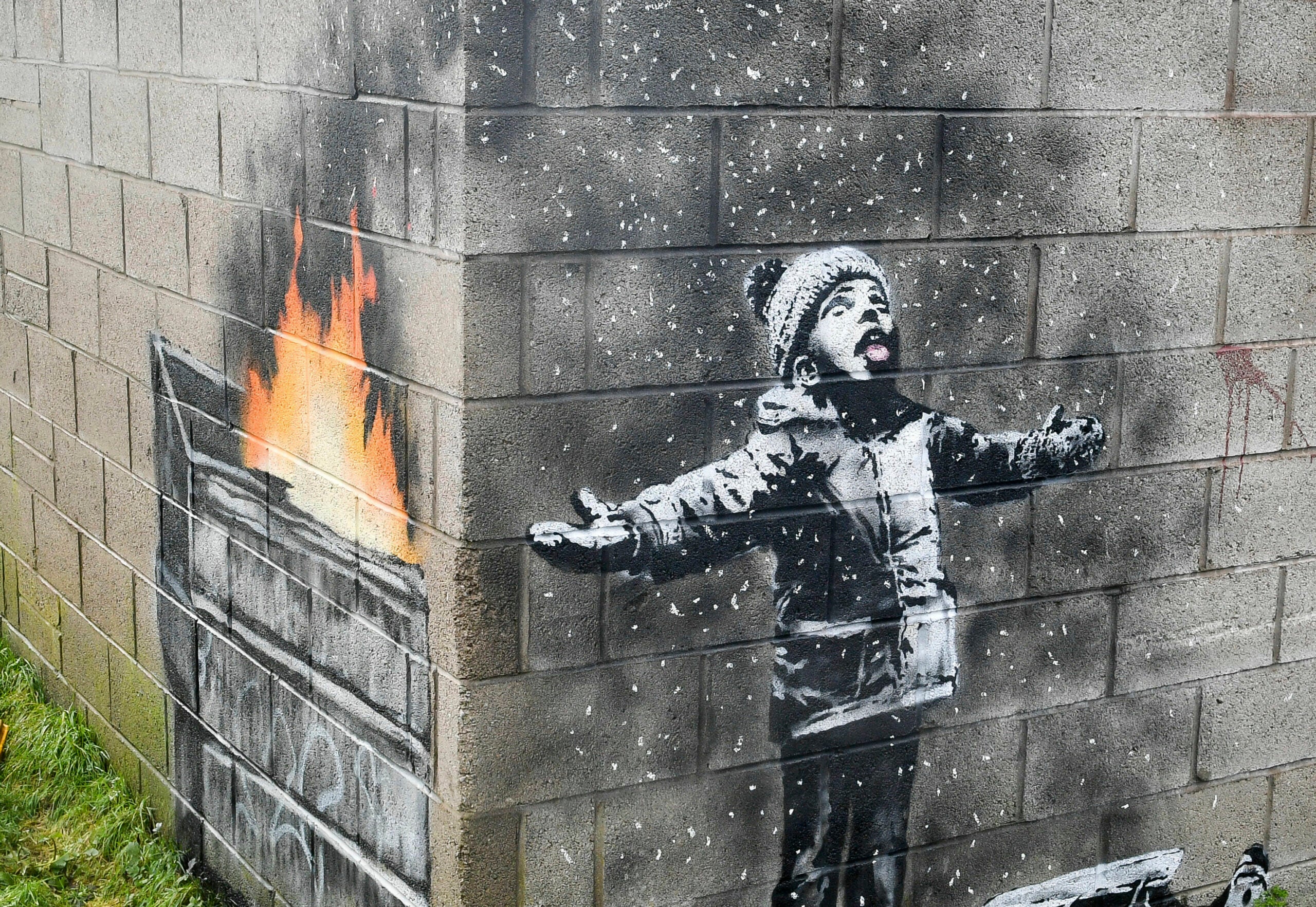 Banksy mural on garage in Wales sold but will stay in place