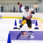 A skater hurdles one of the obstacles during a Crashed Ice wildcard qualifier in Boston.