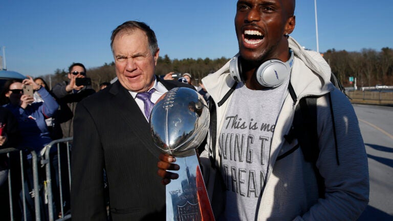 Jason McCourty and BIll Belichick with the Super Bowl trophy.
