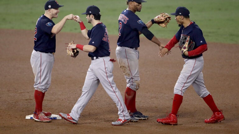 United as baseball champions, Boston Red Sox are divided by Trump