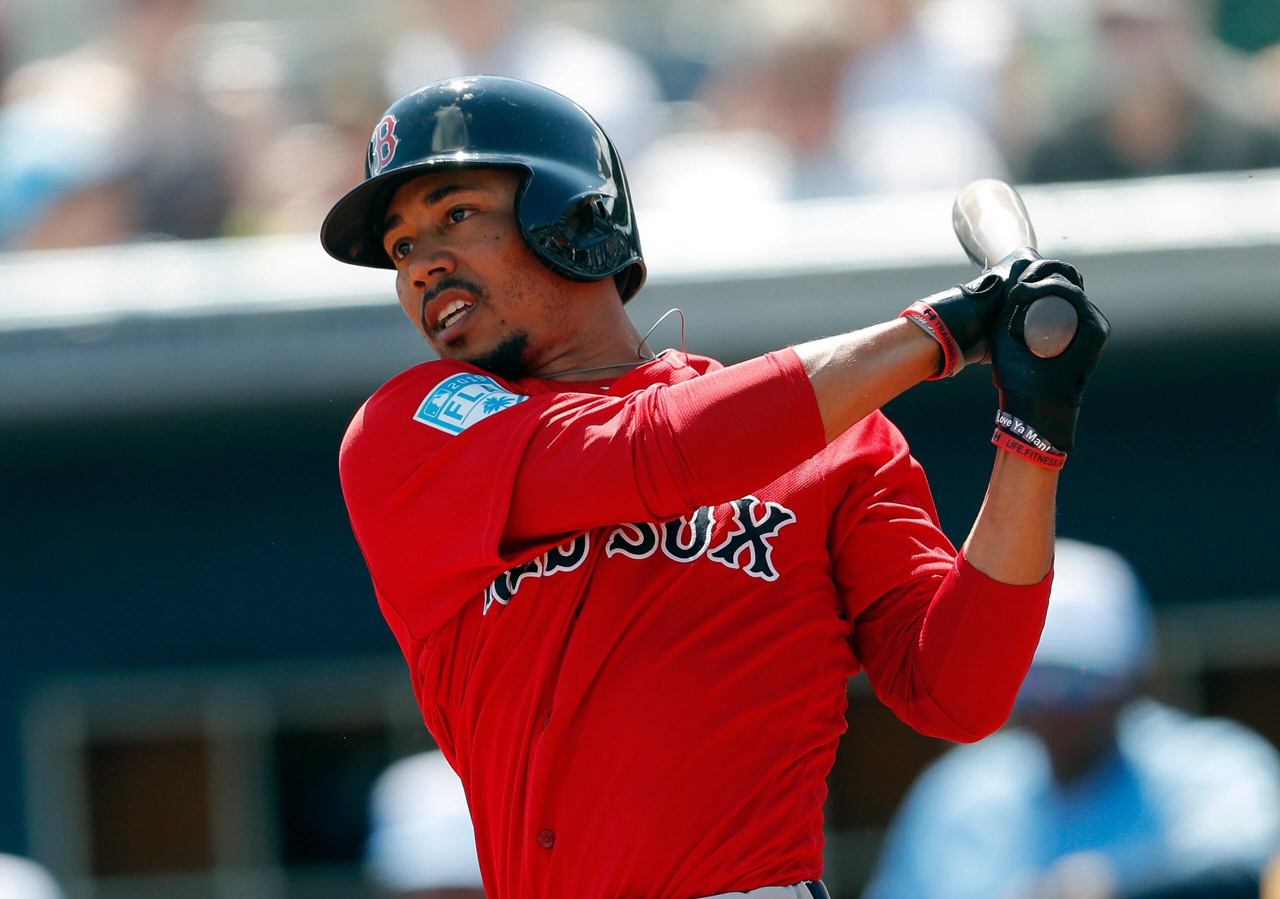 PHOTO: Mookie Betts drives golf cart into water