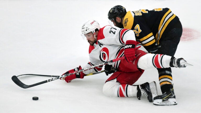 Justin Faulk Patrice Bergeron Bruins Hurricanes