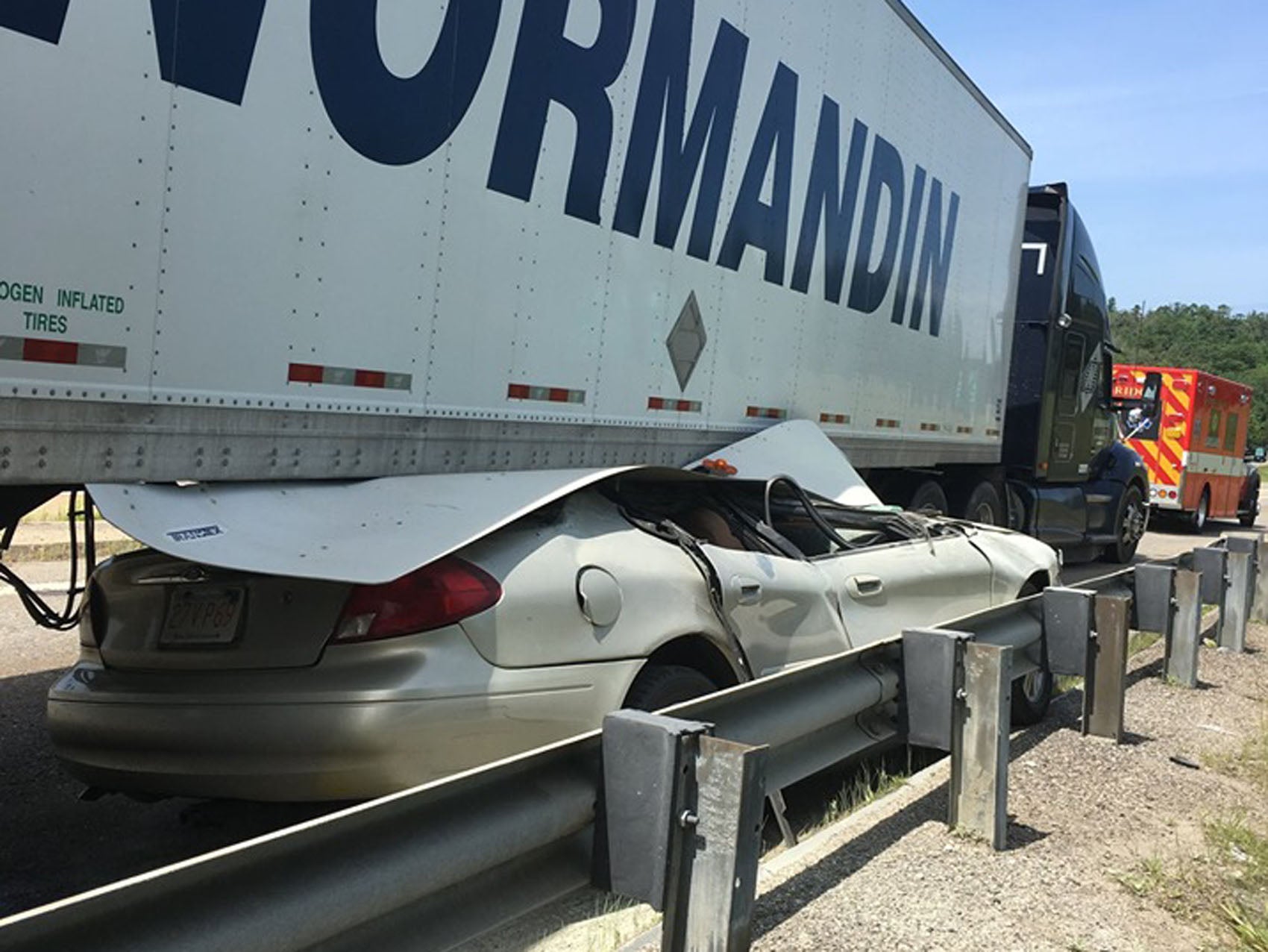 A car slid under a tractortrailer in an Uxbridge crash. Authorities