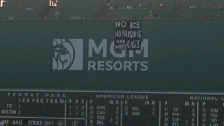 Protestors unfurl 'No ICE, No prisons, No More Cages' banner over Green  Monster at Fenway Park 