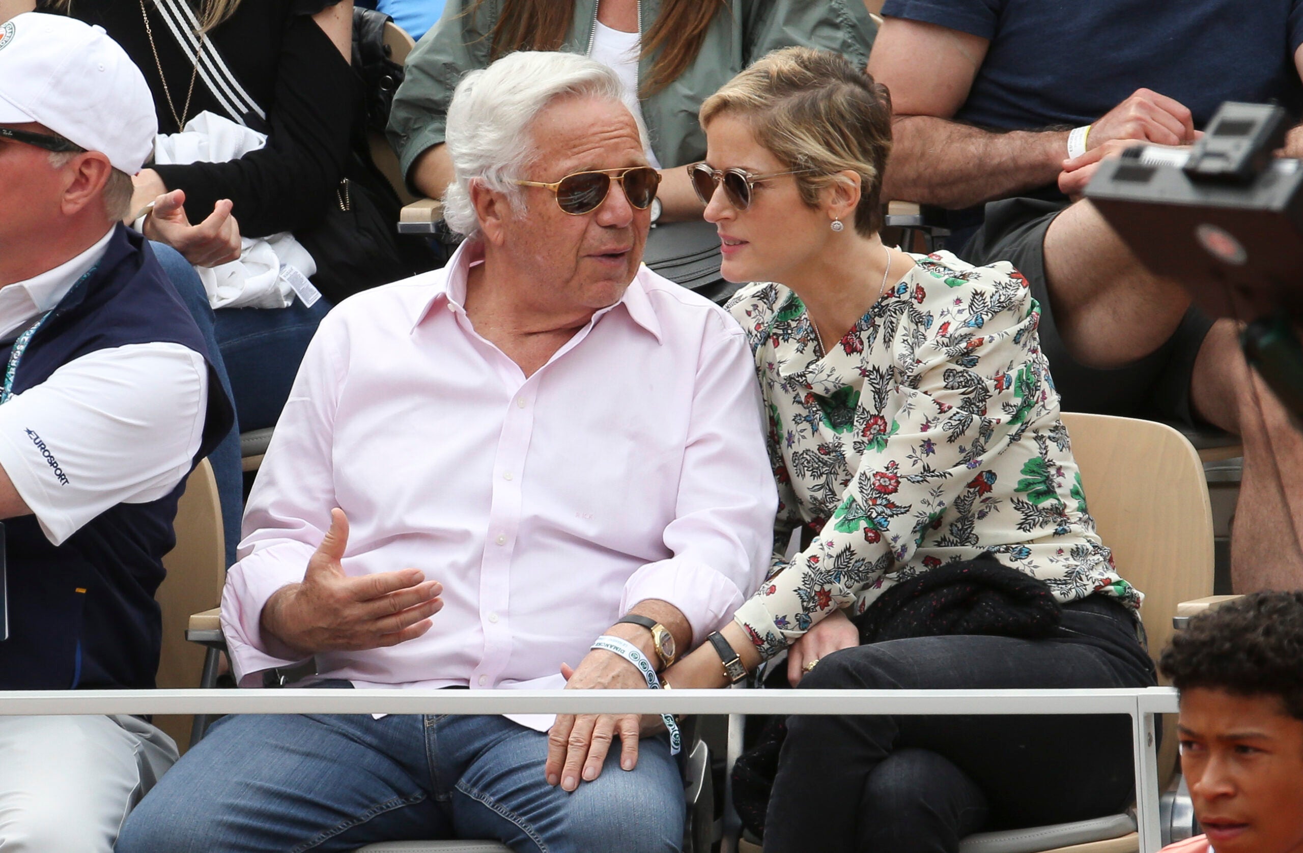 New England Patriots owner Robert Kraft, left, lifts the trophy