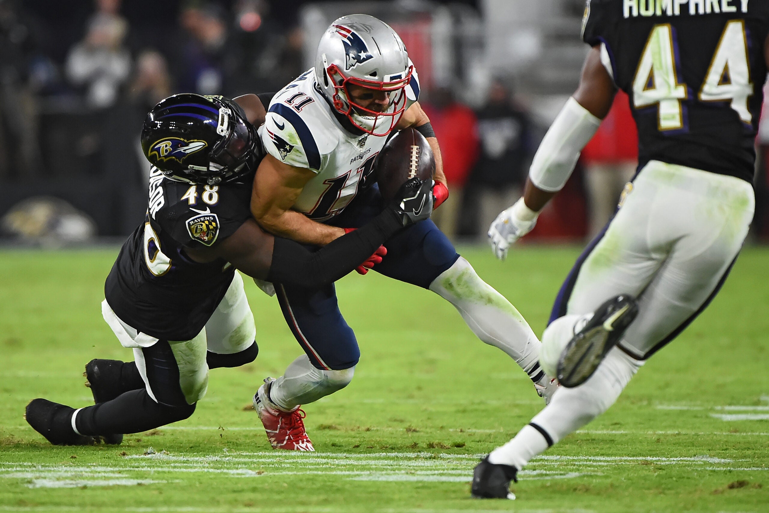 New England Patriots Julian Edelman gets tackled by New York Jets