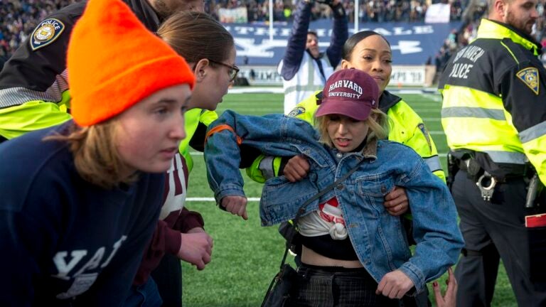 Hundreds of climate protesters disrupt Harvard-Yale game ...