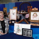 A Boston guest poses with her Norman Rockwell collection on 'Antiques Roadshow' in 2012.
