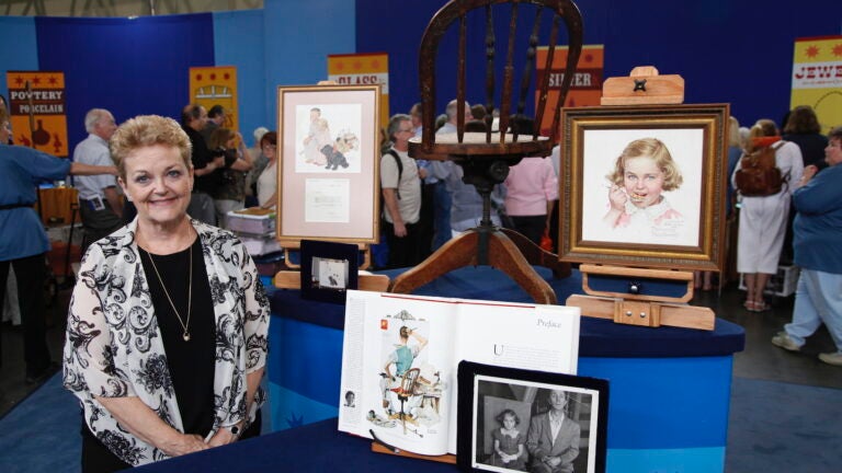 A Boston guest poses with her Norman Rockwell collection on 'Antiques Roadshow' in 2012.