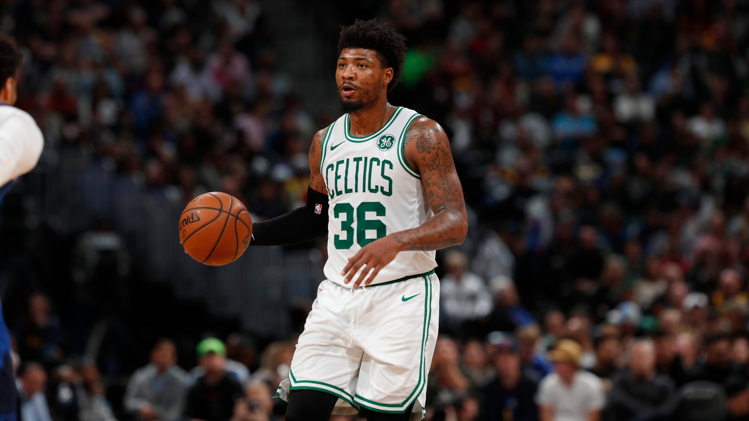 Marcus Smart is helped off the court after apparent injury