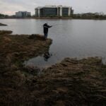 A man fishing in Boston.