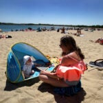 A woman and son on Carson Beach.