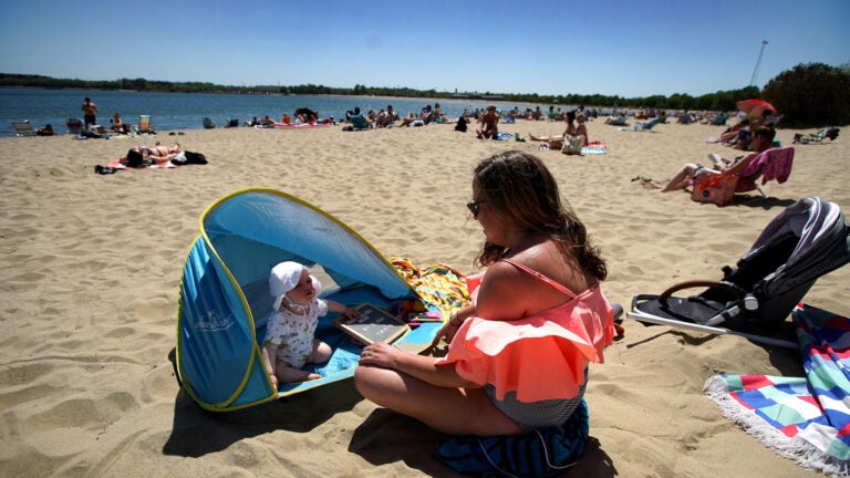 A woman and son on Carson Beach.