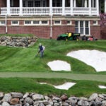 A worker at The Golf Club at Turner Hill