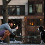 A man and his dog on the Esplanade.