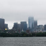 Low clouds hang over the Boston skyline.