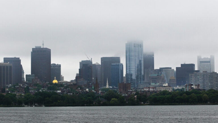 Low clouds hang over the Boston skyline.
