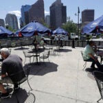 Diners eat outdoors at Mother Anna's restaurant
