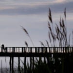 Fishing off the pier near Carson Beach.