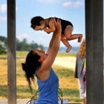 A woman and child at Nelson Street Beach in Plymouth.
