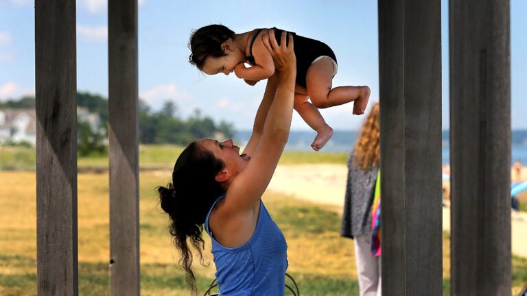 A woman and child at Nelson Street Beach in Plymouth.