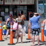 Beachgoers line up for food on Salisbury Beach.