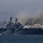 A fire burns on the amphibious assault ship USS Bonhomme Richard.