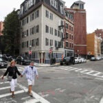 A couple walks in Boston's North End.