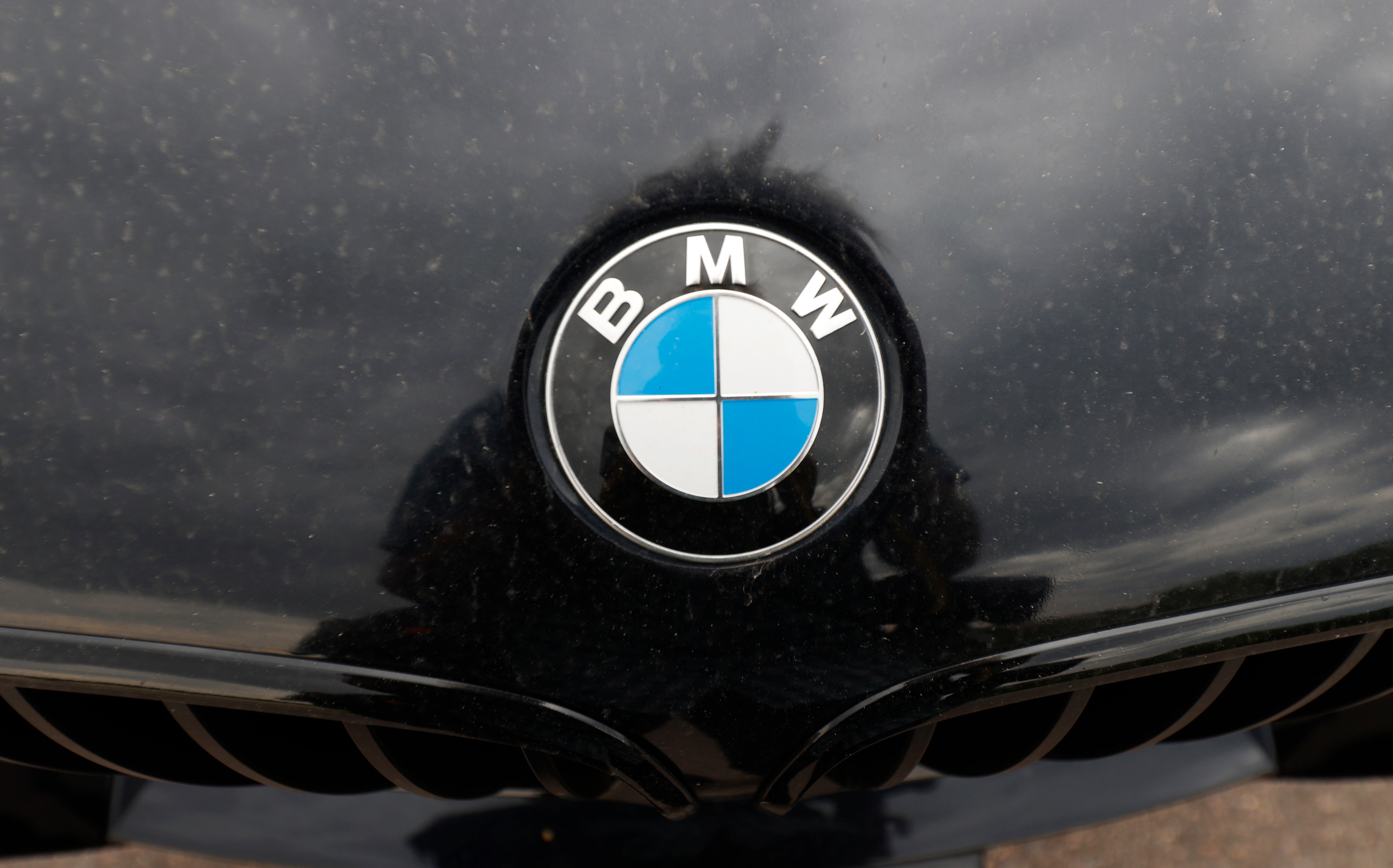 The company logo on the hood of an unsold 2020 5-series sedan